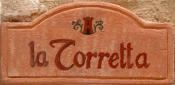 Insegna in terracotta all'ingraesso